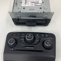 2011-2014 Dodge Charger CD player radio module non navigation with face plate controls..